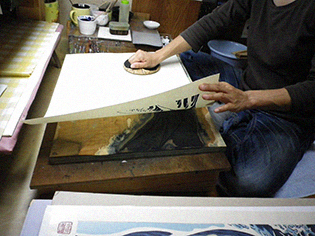 printing - Japanese handmade paper is placed over the painted block and rubbed with a 